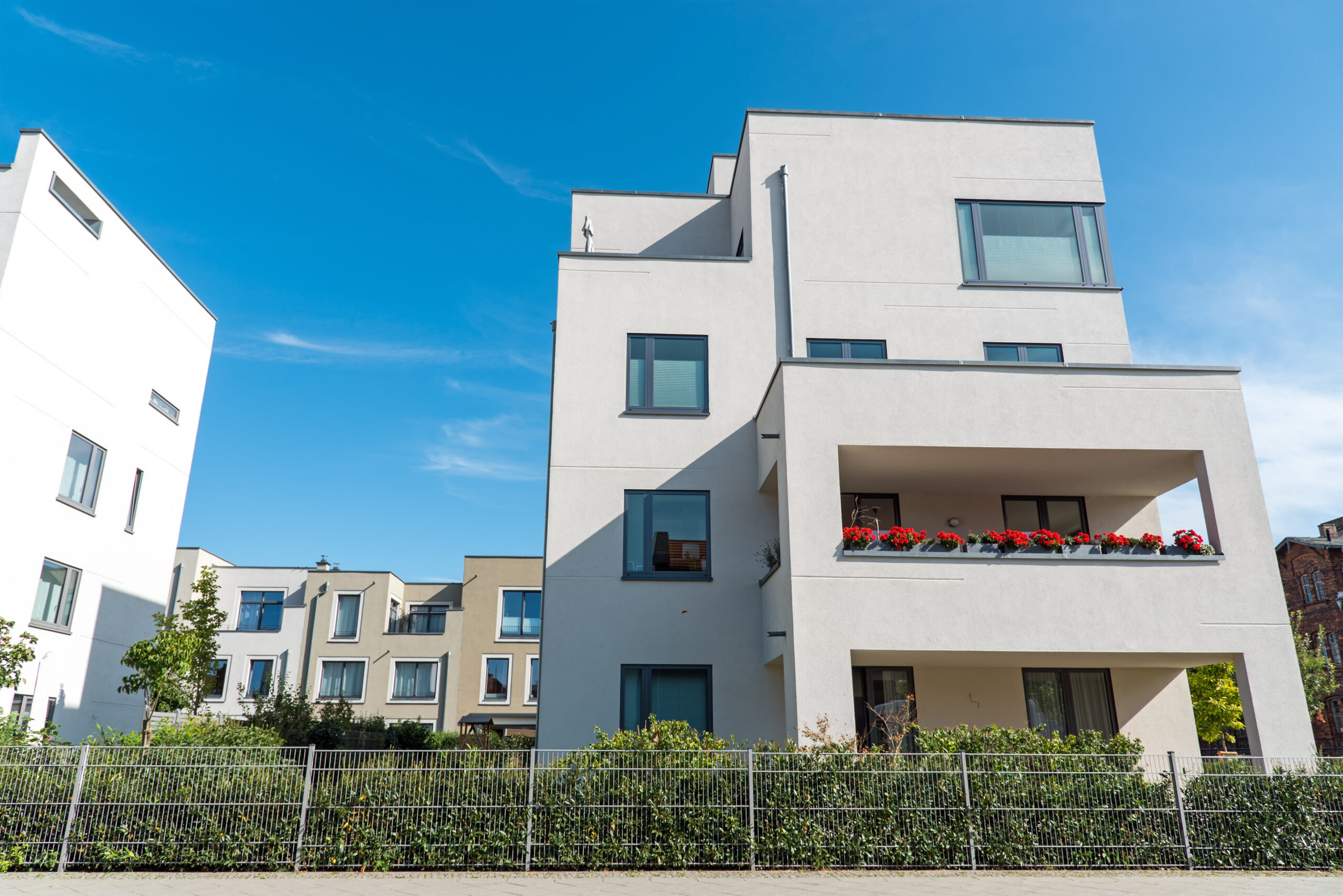 white-modern-houses-in-front-of-a-blue-sky-2023-11-27-05-26-26-utc